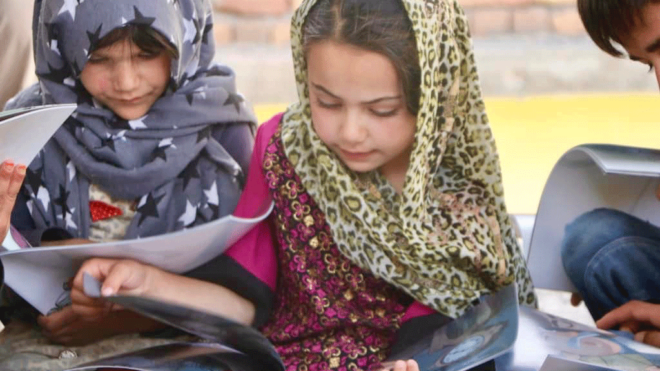 Afghan children reading Idries Shah Children's books